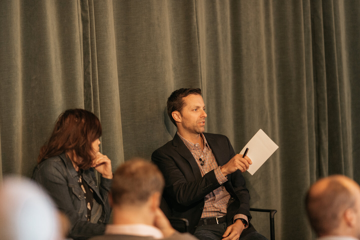 Mike Mudrey in a fireside conversation with a guest speaker at an executive gathering